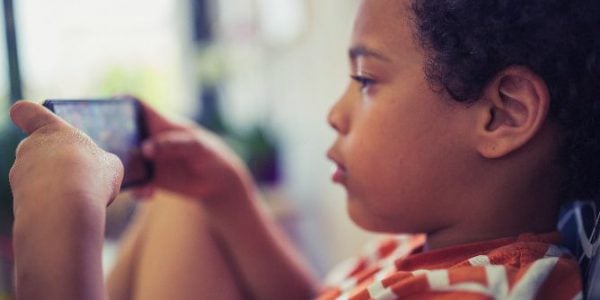 A boy using a smartphone
