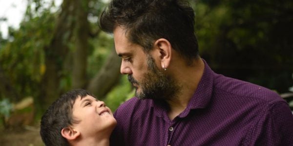 A man holding a smiling child