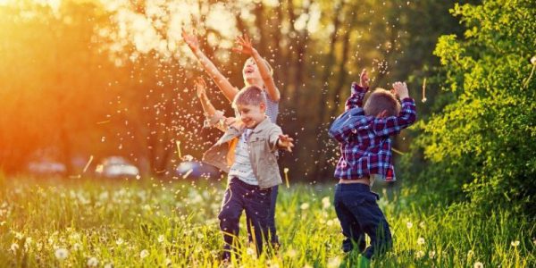 Children playing outside in grass